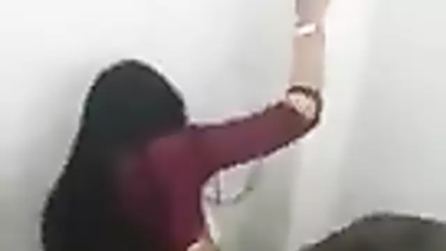 A guy has sex with a clothed Uzbek woman in the restroom