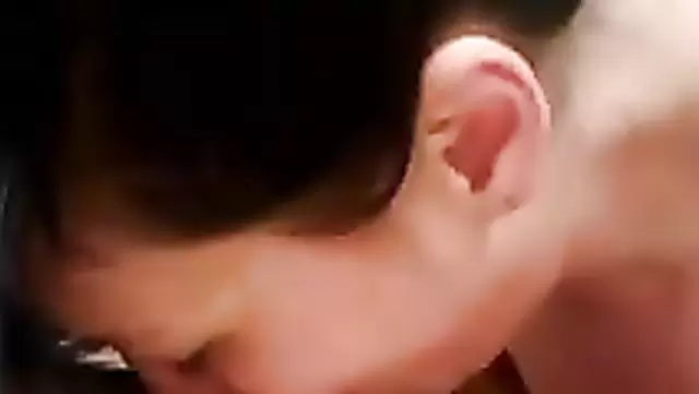 A mature Uzbek woman gives a sensual blowjob to her husband's member