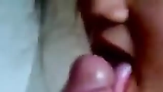 A girl pleasures an Uzbek man's penis with her tongue